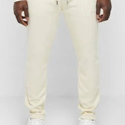 Man Tracksuit Bottoms TRACKSUITS Essential Signature Track Pants - Cream