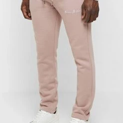 Man Tracksuit Bottoms TRACKSUITS Essential Signature Track Pants- Pink